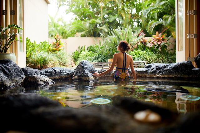 Woman enjoying the spa at a Hilton Grand Vacations Hawaii resort at Hilton Hawaiian Village. 