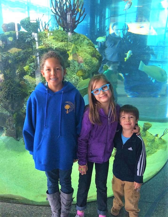 Kids posing at South Carolina Aquarium. 