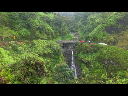 Aerial view of cars driving on the Road to Hana in Maui, Hawaii. 