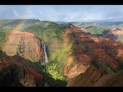  Rainbow  and waterfall in Waimea Canyon State Park in Hawaii. 