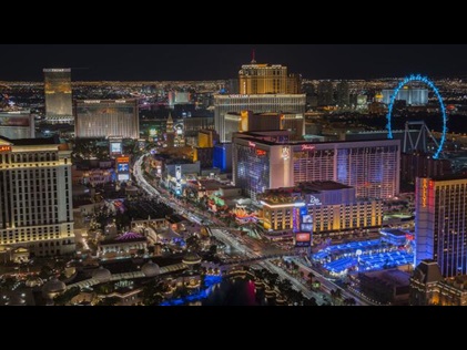 Aerial view of Las Vegas glowing against the night sky. 