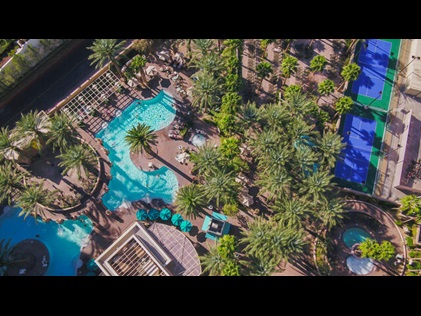 Aerial shot of recreational areas and palm trees at Hilton Grand Vacations on the Boulevard in Las Vegas, Nevada. 