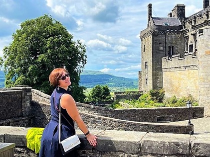 HIlton Grand Vacations Explorer posing at the top of Stirling Castle in Stirling, Scotland.