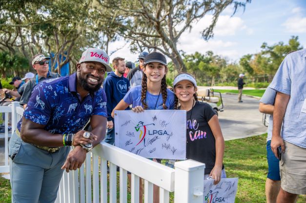 Celebrity posing with young fans at the Hilton Grand Vacations Tournament of Champions, Orlando, Florida. 