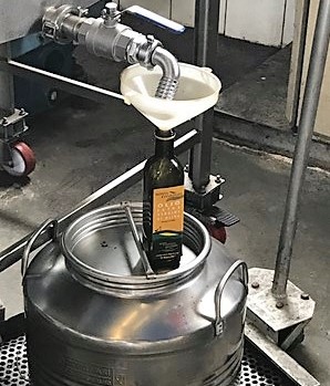 Hilton Grand Vacations Owner's picture of olive oil being bottled, Tuscany, Italy. 