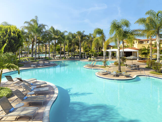 Gorgeous aerial image, bright blue pool and palm trees, MarBrisa, a Hilton Grand Vacations Club, Carlsbad, California. 