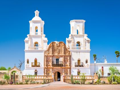 White stucco exterior of Mission San Xavier del Bac, a Spanish mission in Tucson, Arizona