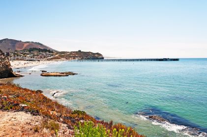 Stunning aerial view, cliffs, crashing waves, blue skies, Avila Beach, California. 