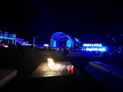 Fire pit and stage at an evening concert of the Hilton Grand Vacations Tournament of Champions