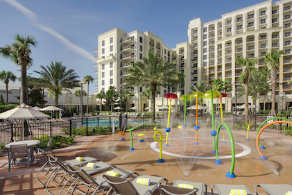 The splash pad pool area on a sunny day at Las Palmeras, a Hilton Grand Vacations Club, Orlando, Florida