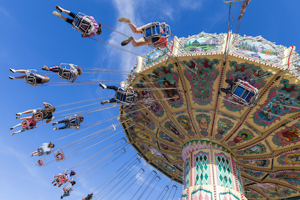 A group of people on a swing ride at a theme park