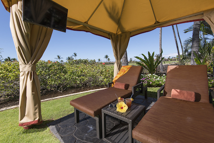 A pair of cozy lounge chairs in a private cabana at Kohala Suites, a Hilton Grand Vacations Club, Waikoloa, Hawaii