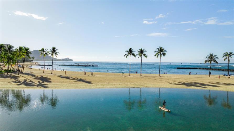 Lagoon with palm trees, near Hilton Hawaiian Village in Oahu, Hawaii