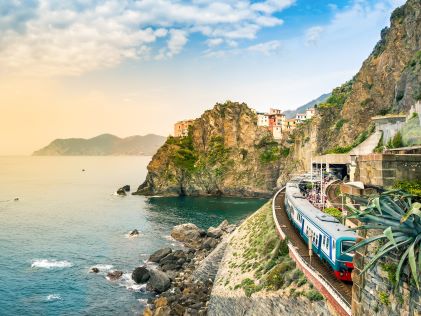 A train running through the hillside of Lake Cuomo in Italy