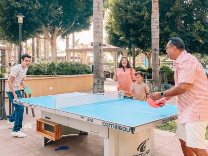 A Hilton Grand Vacations family enjoys amenities at MarBrisa, a Hilton Grand Vacations Club in Carlsbad, California