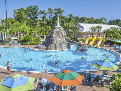 Outdoor pool with water slides at Cypress Pointe, a Hilton Vacation Club in Orlando