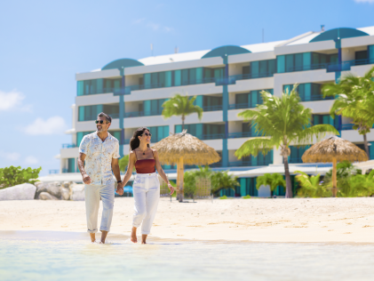 A couple walks on the beach at Royal Palm, a Hilton Vacation Club in Sint Maarten