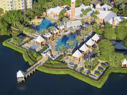 Drone view of the pool, cabanas and surrounding lake at SeaWorld Orlando, a Hilton Grand Vacations Club