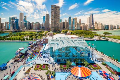 Aerial image, local businesses, Navy Pier, Chicago skyline in the distance, Illinois. 