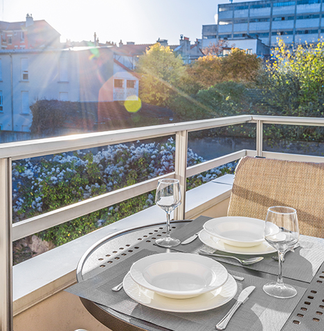 Dining table for two outside on a balcony